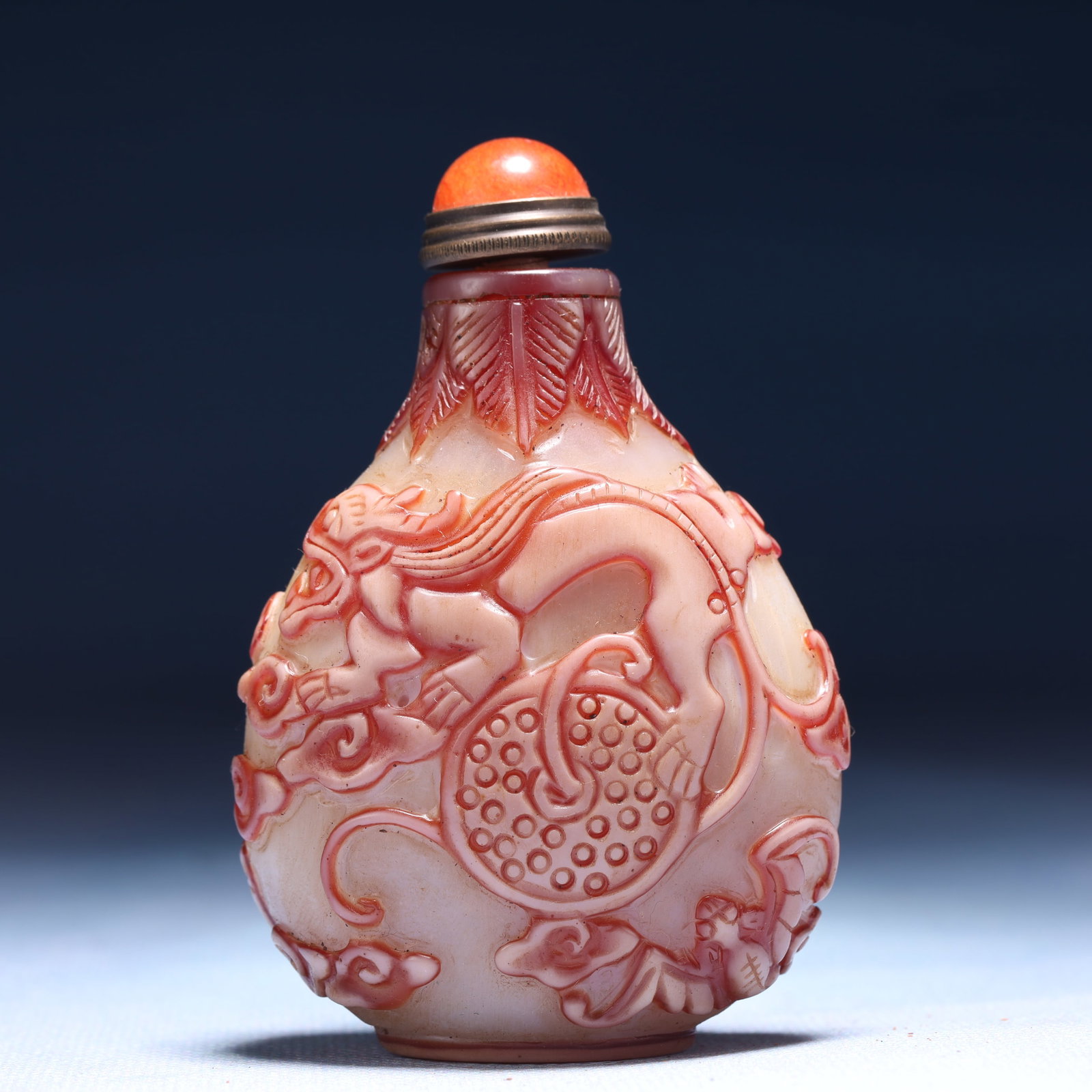 An Exquisite Glass Auspicious Cloud and Dragon Pattern Snuff Bottle: An Exquisite Glass Auspicious Cloud and Dragon Pattern Snuff Bottle,Qing Dynasty,China,Qianlong Four-character Mark,Size:2.4inx1.2inx3.3in,Weight:82g