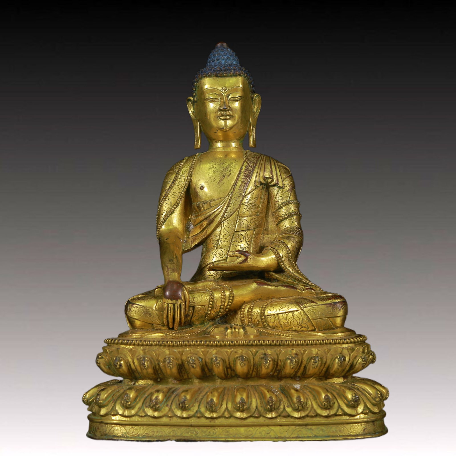 A Solemn Gilt Bronze Statue of Sakyamuni: A Solemn Gilt Bronze Statue of Sakyamuni ,Ming Dynasty, China,Size: 7.1inx5.1inx10.2in,Weight:3310g 铜鎏金释迦摩尼像，明代