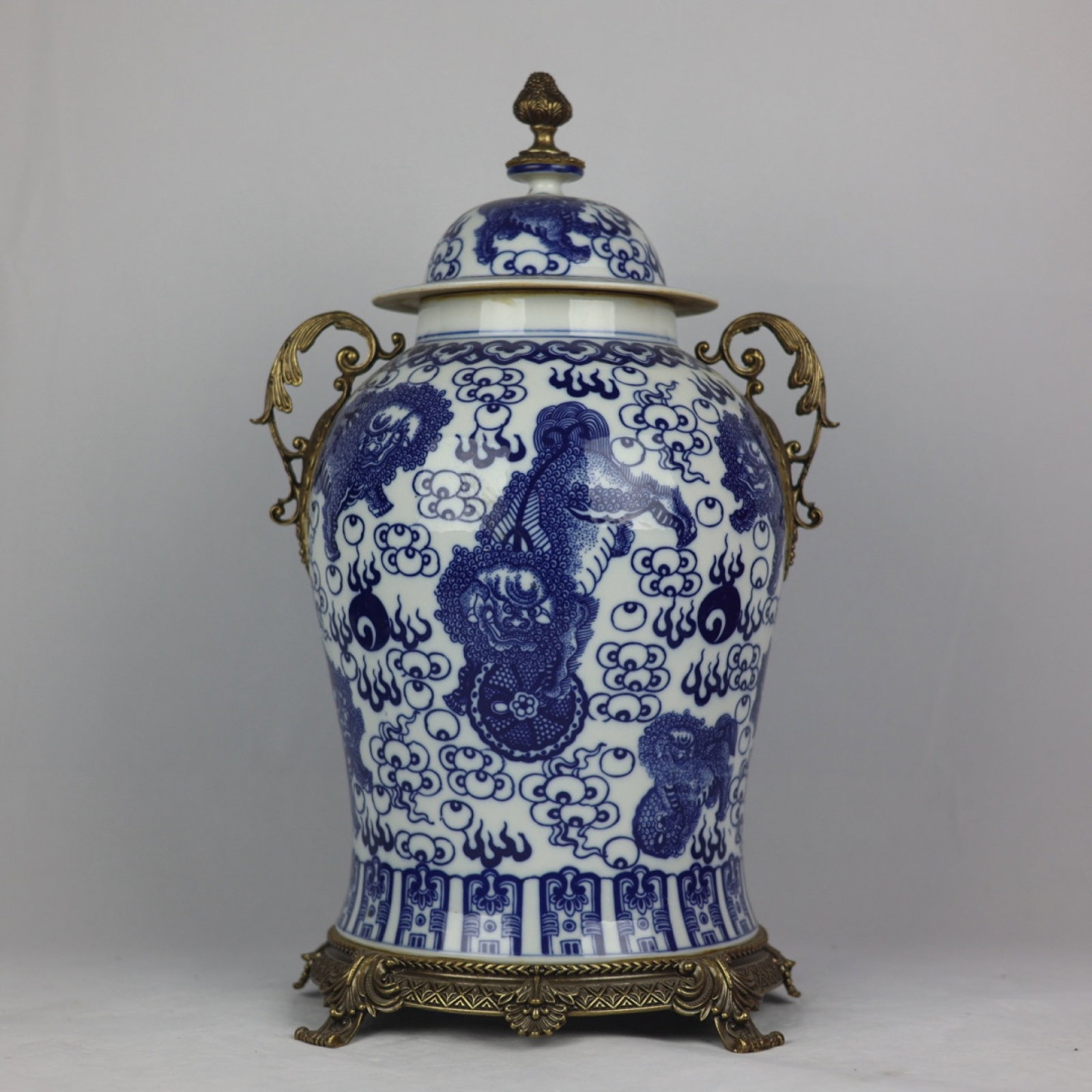 A Huge Blue and White Inlaid Bronze Lion Pattern Double-Ears Jar with Cover: A Huge Blue and White Inlaid Bronze Lion Pattern Double-Ears Jar with Cover,Qing Dynasty,China,Kangxi Six-character Mark,Size:20.5inx11.8in