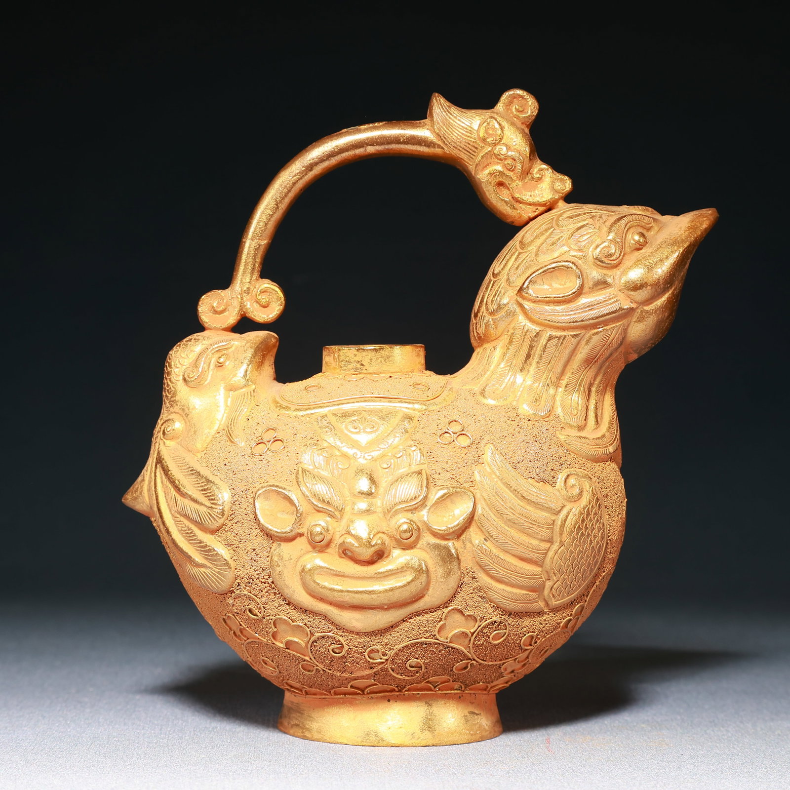 An Exquisite Gilt Bronze Beast-Face Pattern Dragon-head Bird-Shaped Ewer: An Exquisite Gilt Bronze Beast-Face Pattern Dragon-head Bird-Shaped Ewer,Qing Dynasty,China,Size:5.9inx3.5inx6.7in,Weight:350g