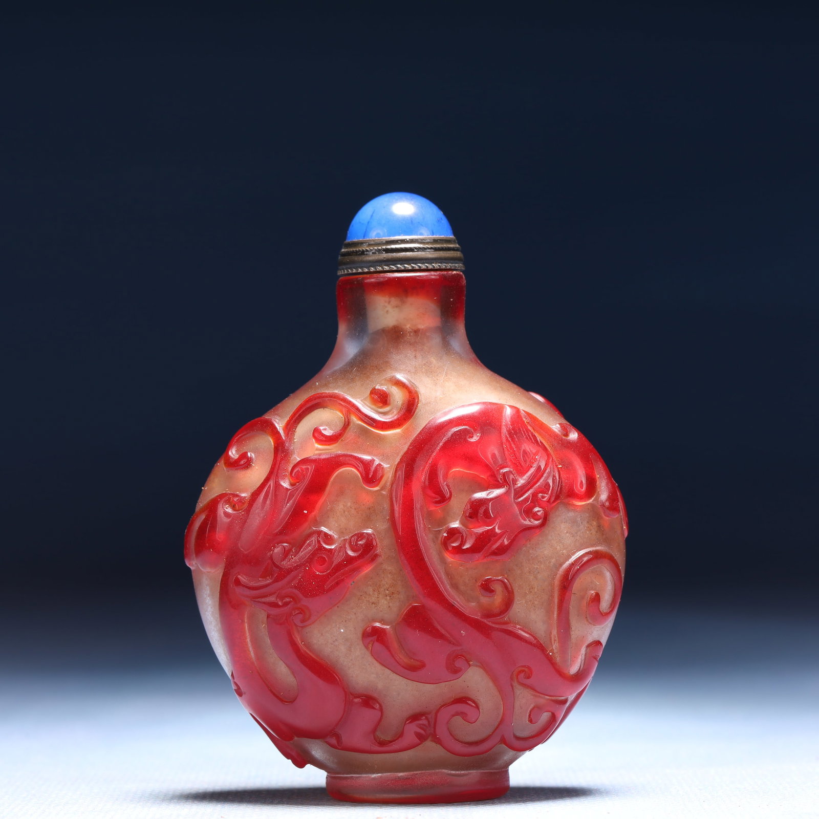 An Exquisite Glass Chi-Dragon Pattern Snuff Bottle: An Exquisite Glass Chi-Dragon Pattern Snuff Bottle,Qing Dynasty,China,Size:2.4inx1inx3in,Weight:61g 琉璃螭龙纹鼻烟壶,中国清代