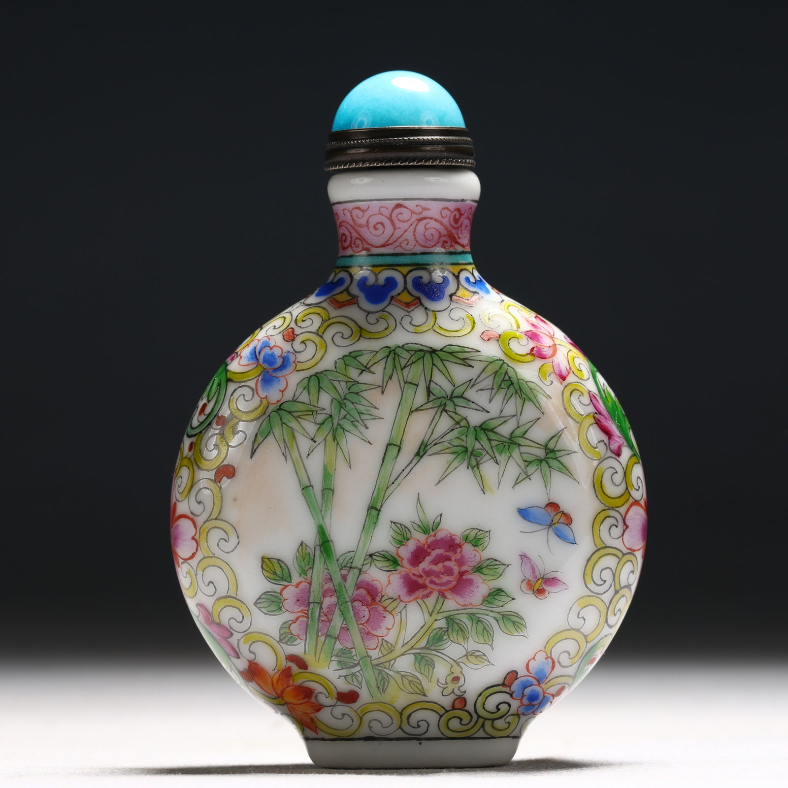 An Exquisite Enamel Flower and Butterfly Pattern Porcelain Snuff Bottle: An Exquisite Enamel Flower and Butterfly Pattern Porcelain Snuff Bottle,Qing Dynasty, China,Qianlong Mark,Size:2.2inx0.8inx3.1in 瓷胎画珐琅彩花卉蝴