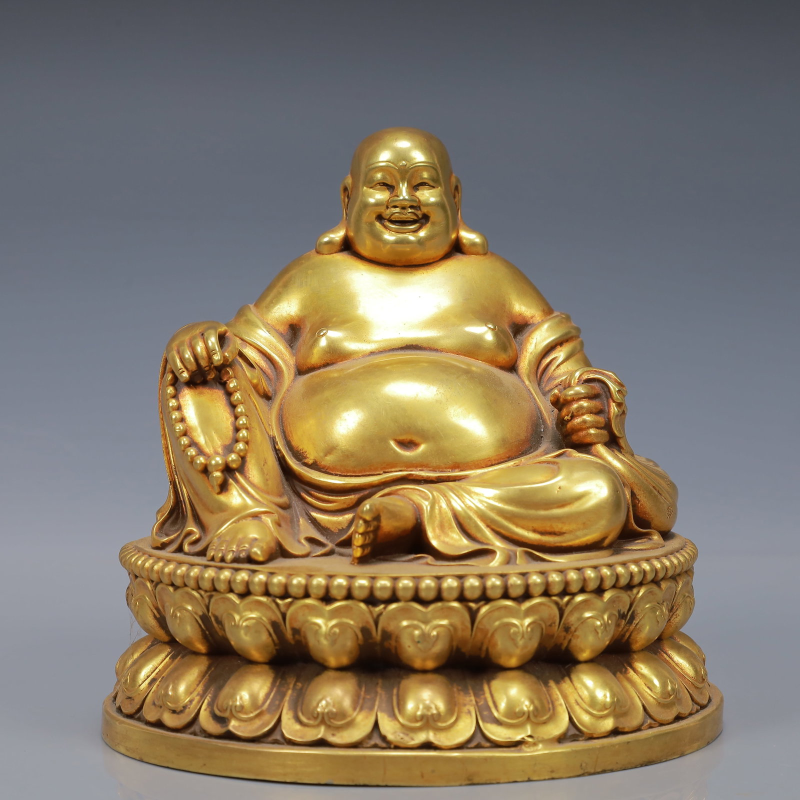 An Exquisite Gilt Bronze Statue of Maitreya Buddha: An Exquisite Gilt Bronze Statue of Maitreya Buddha,Ming Dynasty, China,Yongle Six-character Mark,Size:5.9inx5.5inx5.9in,Weight:4600g 铜鎏金弥勒佛像,中&#