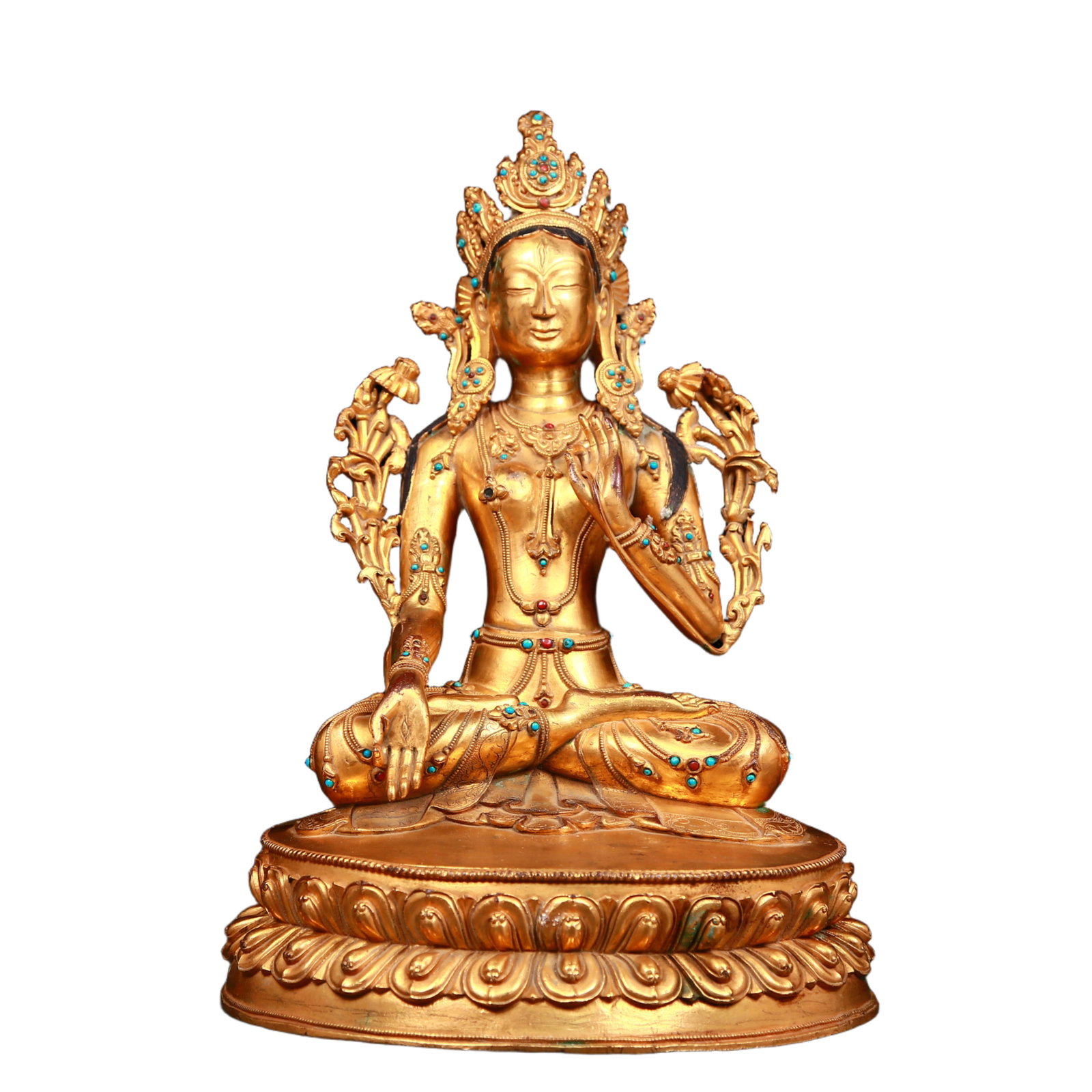A stunning gilt bronze statue of Tara inlaid with gems: A stunning gilt-bronze statue of Tara inlaid with gems, Qing Dynasty, China. Tara has an elegant posture with a peaceful and compassionate expression. Her face is soft and solemn, and her eyes are war