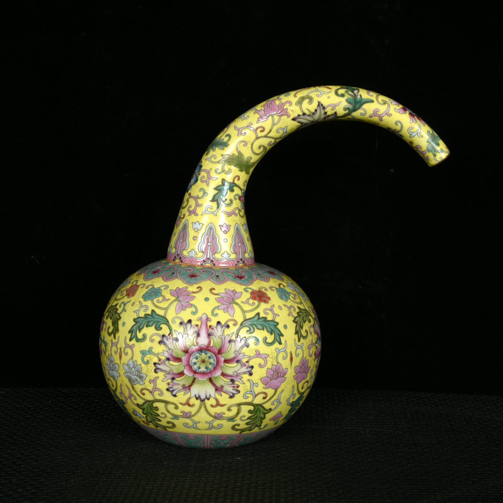 An Exquisite Yellow Ground Enamel Lotus Pattern Pot: An Exquisite Yellow Ground Enamel Lotus Pattern Pot,Qing Dynasty,China,Kangxi Six-character Mark,Size:9.2inx5.9in 黄地珐琅彩缠枝莲纹壶,È
