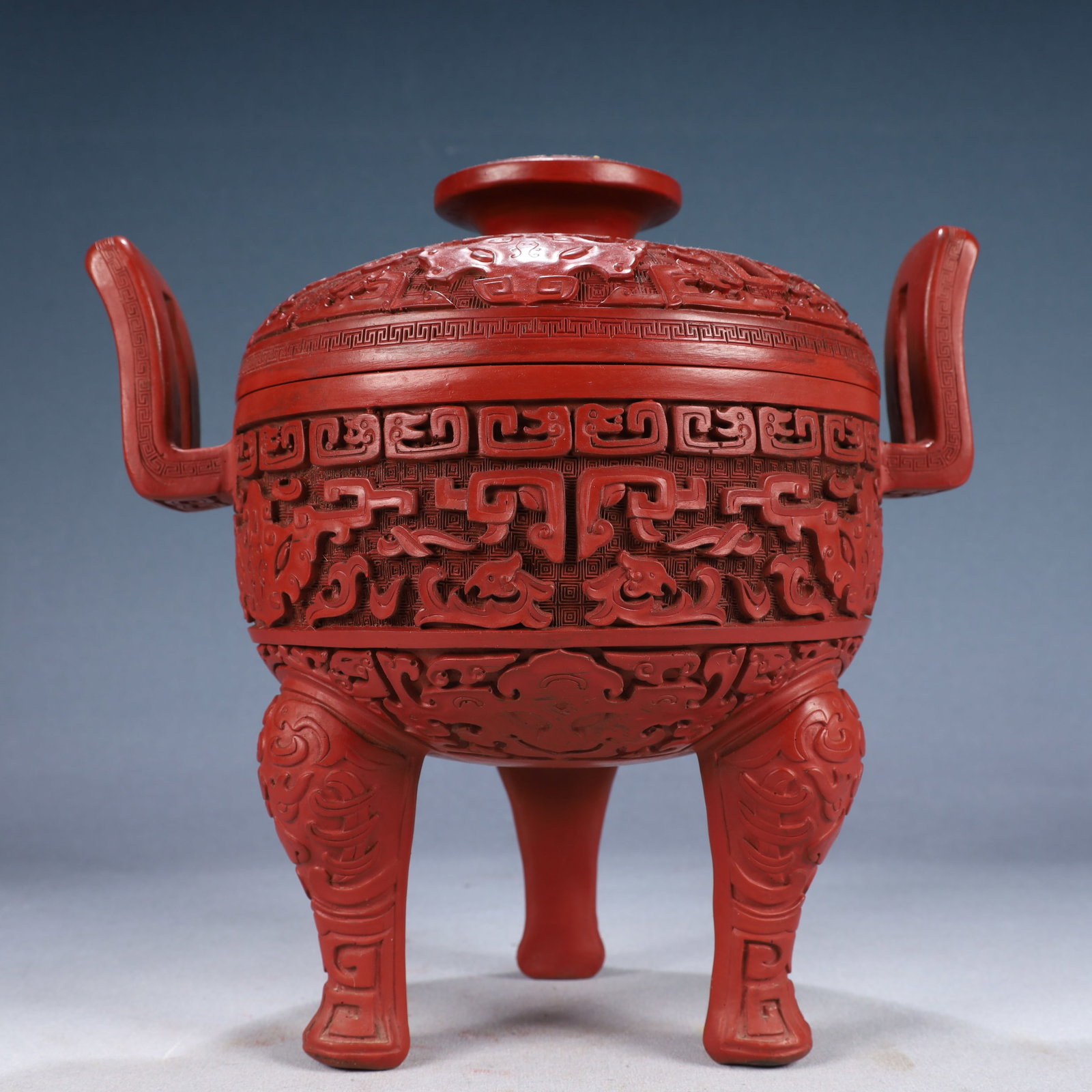 An Exquisite Carved Red Lacquer Beast-Face and Chi-Dragon Pattern Double-Ears and Tripod??¯: An Exquisite Carved Red Lacquer Beast-Face and Chi-Dragon Pattern Double-Ears and Tripod香炉,Qing Dynasty, China,Qianlong Six-character Mark,Size:10.2inx7.1inx10.2in,Weight:1900g