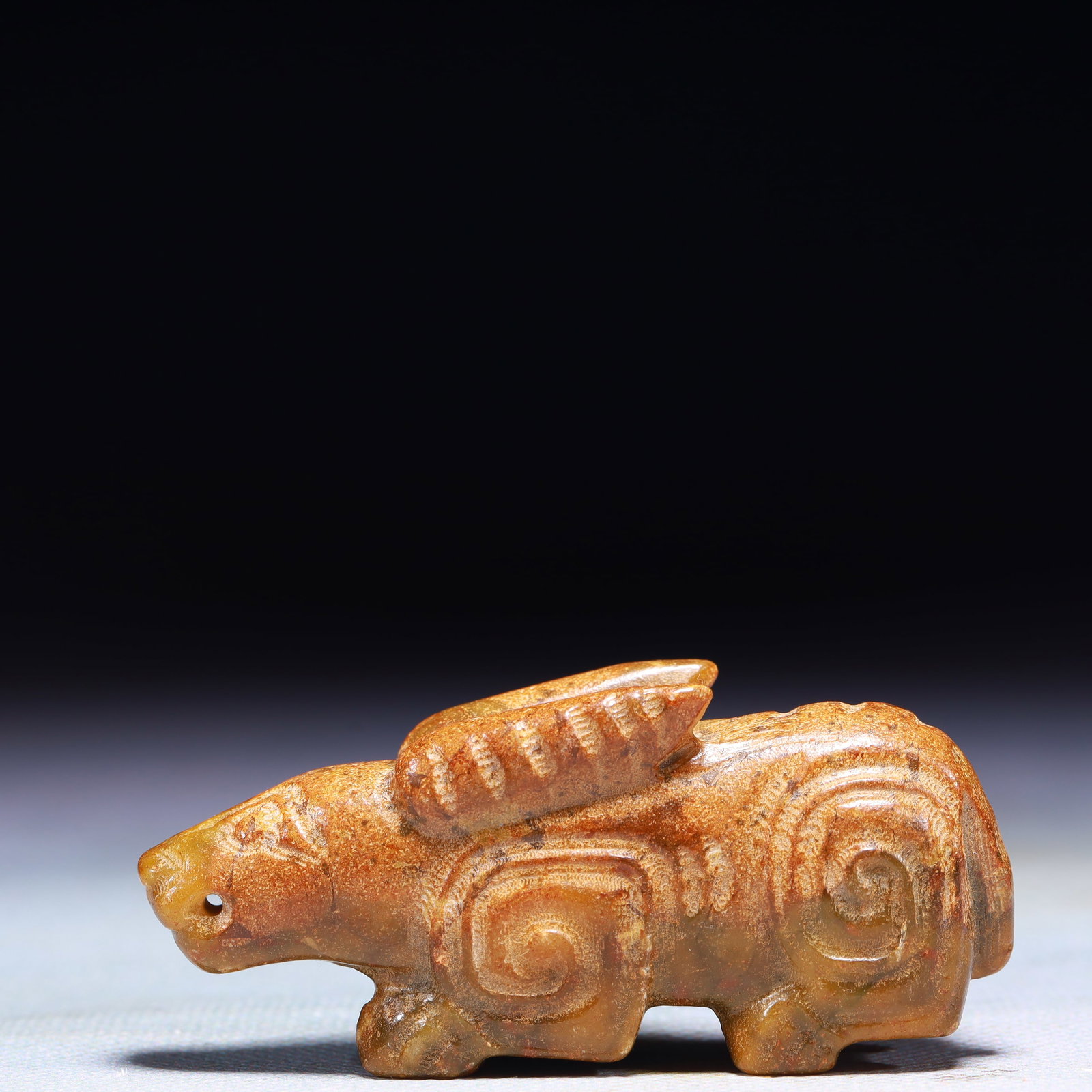 An Exquisite Archaic Jade Rabbit Ornament: An Exquisite Archaic Jade Rabbit Ornament,Ancient Time,China,Size:2.8inx0.8inx1.2in,Weight:76g 高古玉兔子摆件中国远古时期