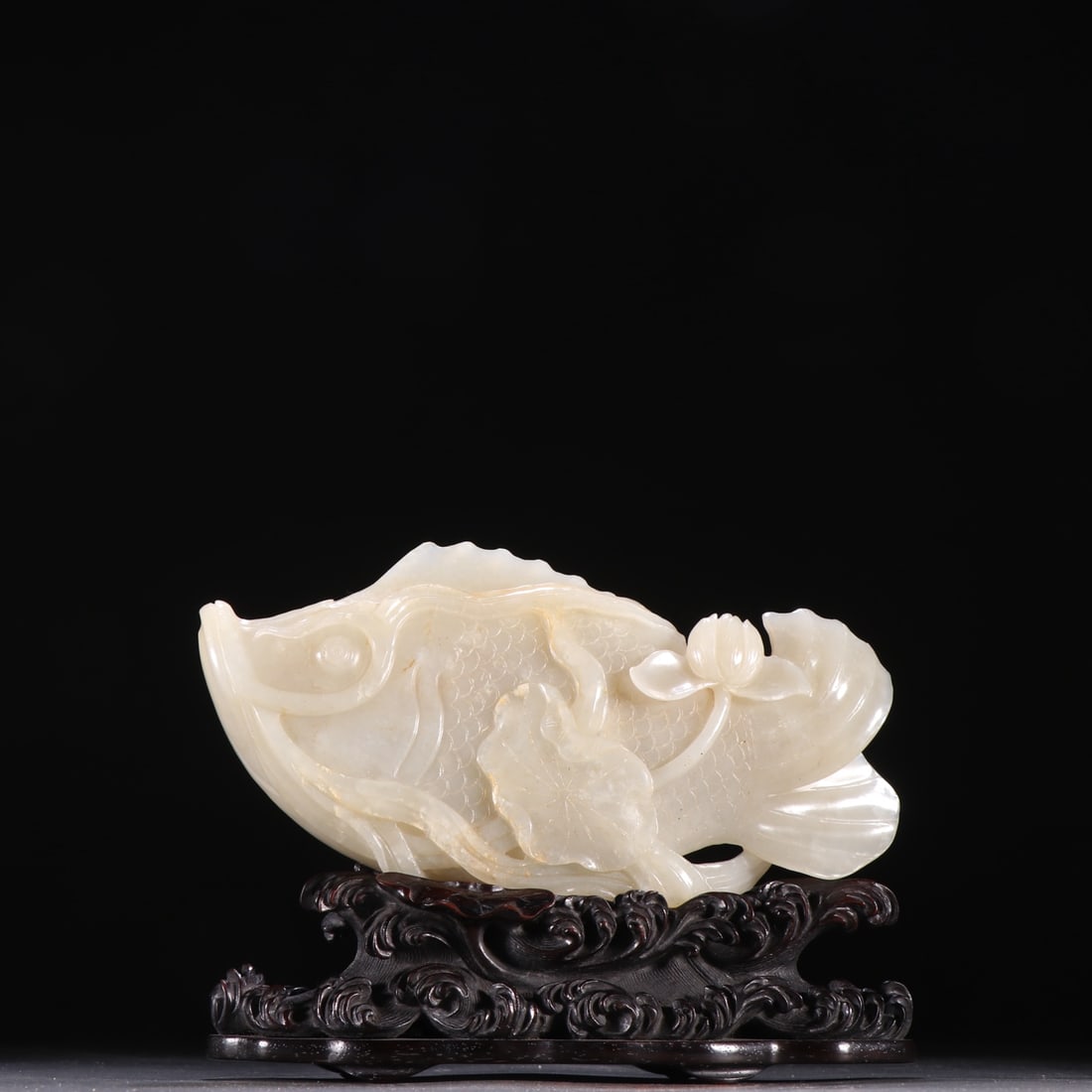 An Exquisite White Jade Fish-Shaped Ornament,With Zitanwood Base (1 of 9)