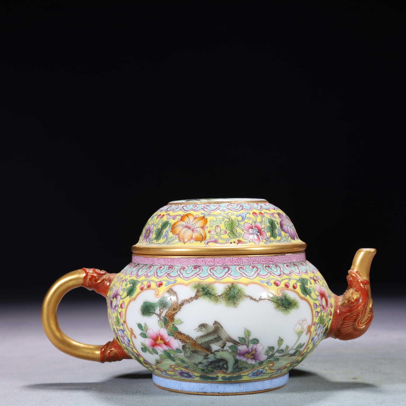 An Exquisite Yellow Ground Famille-Rose Lotus Pattern Teapot: An Exquisite Yellow Ground Famille-Rose Lotus Pattern Teapot,Qing Dynasty,China,Qianlong Four-character Mark,Size:6.3inx3.9inx3.1in,Weight:650g 黄地粉彩缠枝莲