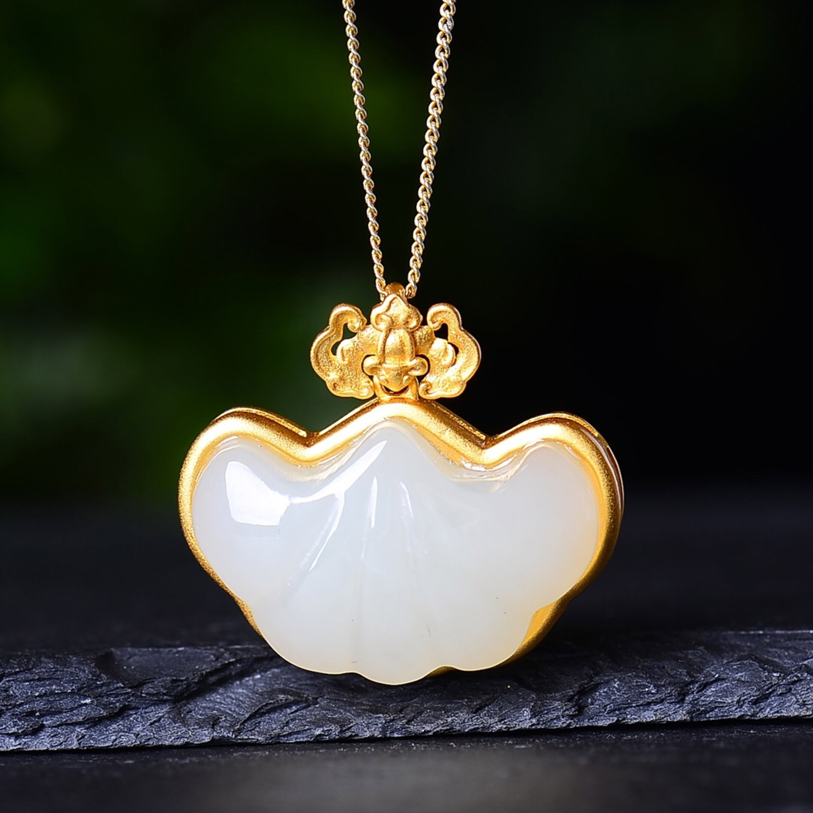 An Exquisite Sterling Silver-Gold Plated Inlaid White Jade Pendant: An Exquisite Sterling Silver-Gold Plated Inlaid White Jade Pendant,Size:0.6inx0.9in 纯银镀金镶白玉吊坠
