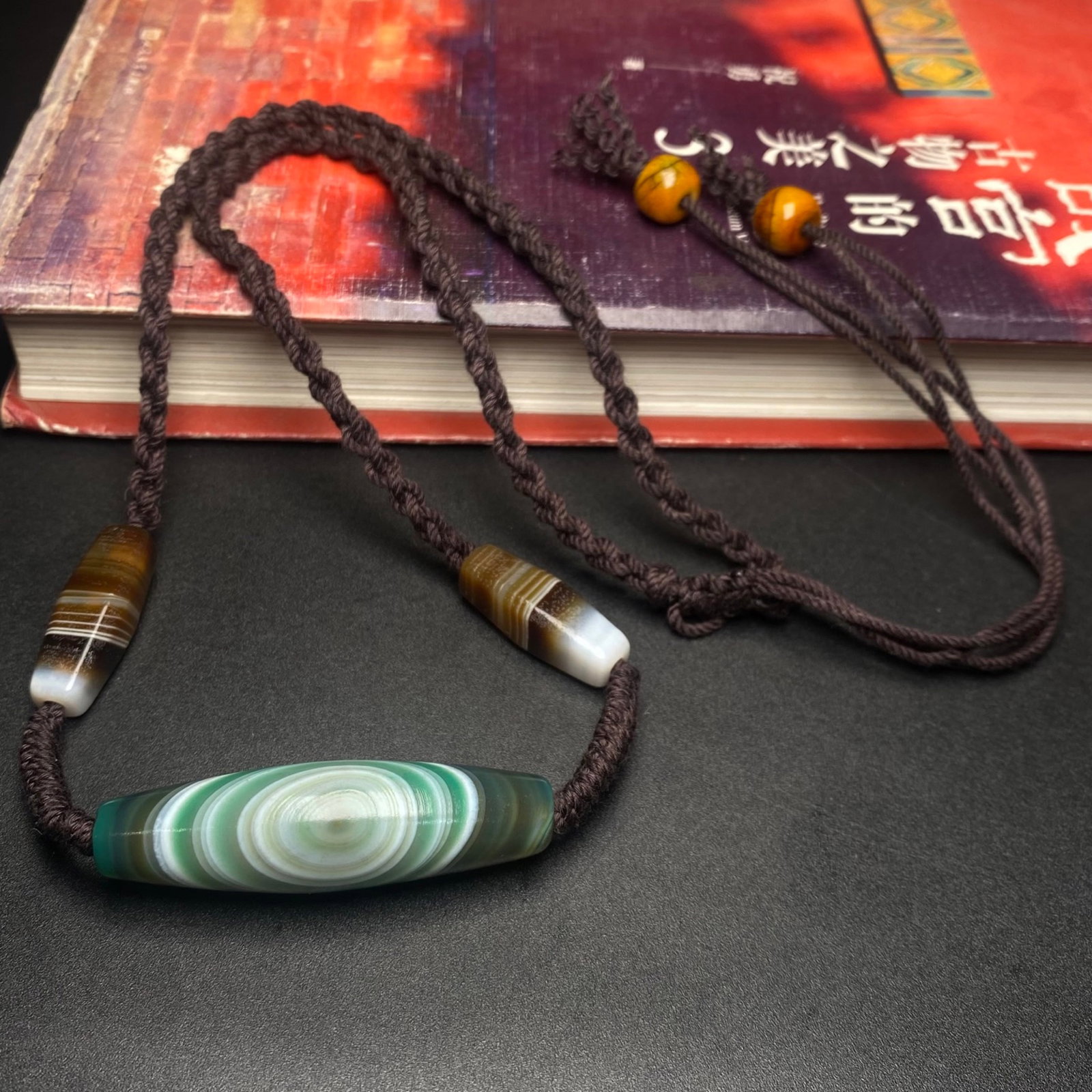An Exquisite Dzi Bead Inlaid Agate Pendant (1 of 8)