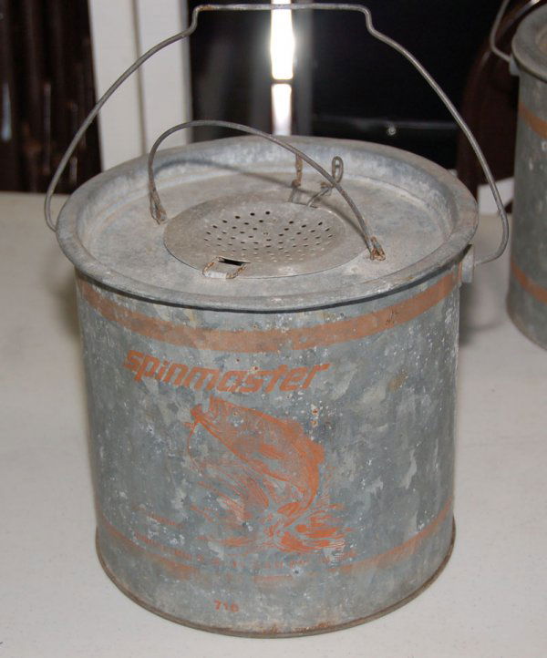 This is a Spinmaster Bait Bucket., No. 710, Galvan: This is a Spinmaster Bait Bucket., No. 710, Galvanized Metal Minnow Bucket. Has some faded graphics, but otherwise in nice shape for the age.
