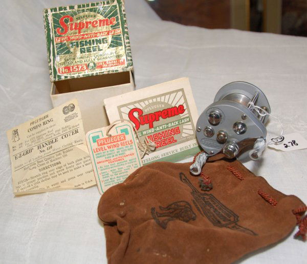 Pflueger model no. 1573 Supreme reel in box, w/ pa: Pflueger model no. 1573 Supreme reel in box, w/ papers, hang tag and leather pouch.