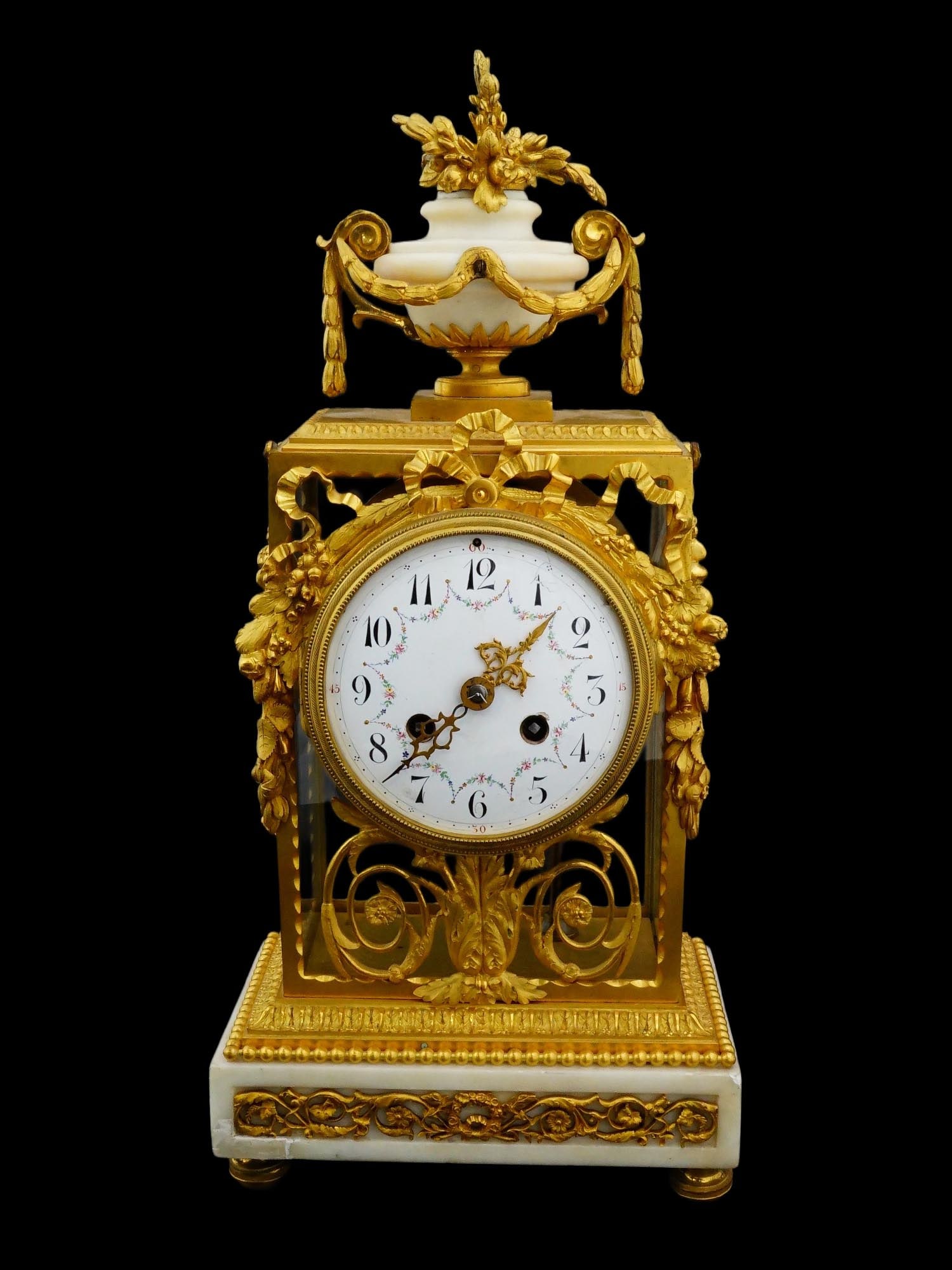 ANTIQUE FRENCH GILT BRONZE MARBLE MANTEL CLOCK: An antique French mantel clock crafted in the elegant Louis XVI neoclassical style, featuring a rectangular glazed case that displays the internal mechanical movement. The timepiece is constructed wit