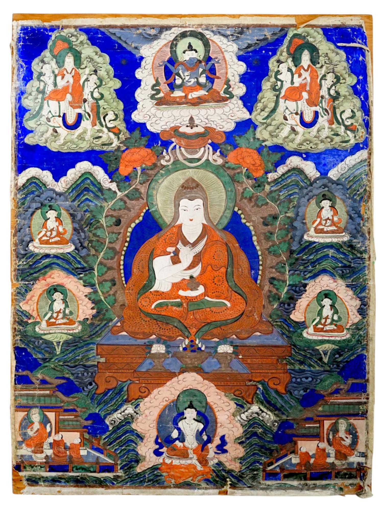 LARGE SINO-TIBETAN PAINTED THANGKA MOUNTED ON BOARD: A large and vibrantly colored Sino-Tibetan thangka, executed in distemper on cloth. The central composition features a prominent seated Lama or Bodhisattva wearing flowing orange and red monastic robe