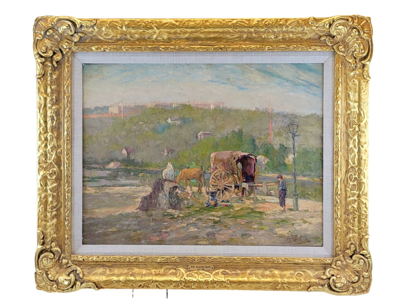 UKRAINIAN ELIE ANATOLE PAVIL ENCAMPMENT OIL PAINTING: This original oil on canvas painting, titled "Encampment," is the work of Ukrainian-French artist Elie Anatole Pavil (1873-1948). The luminous composition depicts a rustic gathering featuring a covere