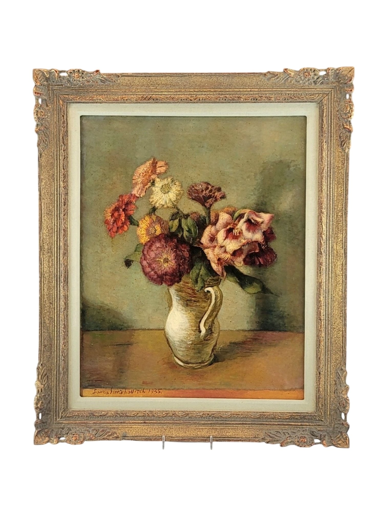 SIMKA SIMKHOVICH 1935 OIL ON CANVAS STILL LIFE FLOWERS: This 1935 oil on canvas still life features a vibrant arrangement of zinnias and mixed blooms displayed in a white ceramic pitcher against a muted, textured green background. The composition demonstra