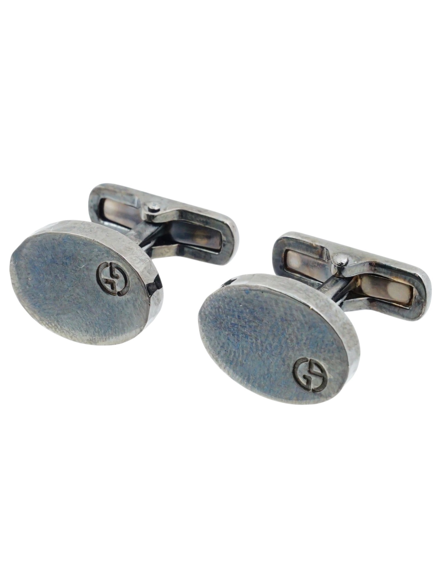 GIORGIO ARMANI STERLING SILVER CUFFLINKS ITALY: This pair of authentic Giorgio Armani cufflinks is crafted from sterling silver and features a modern, minimalist design made in Italy. Each cufflink is designed with an oval face featuring a smooth w