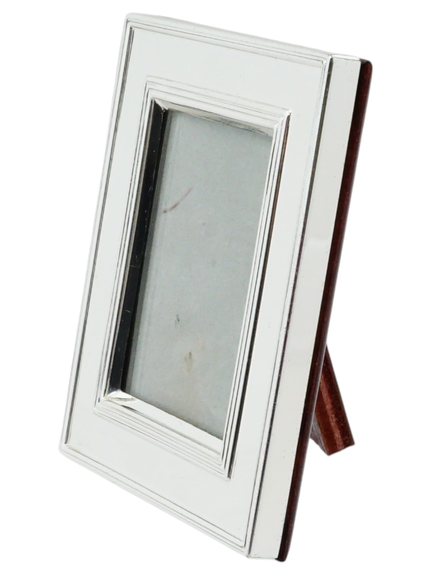 CHRISTOFLE MINIATURE SILVER PLATED PICTURE FRAME: This elegant miniature picture frame by Christofle features a polished silver-plated rectangular border with a classically tiered inner profile. The outer edge is stamped with the Christofle maker's n