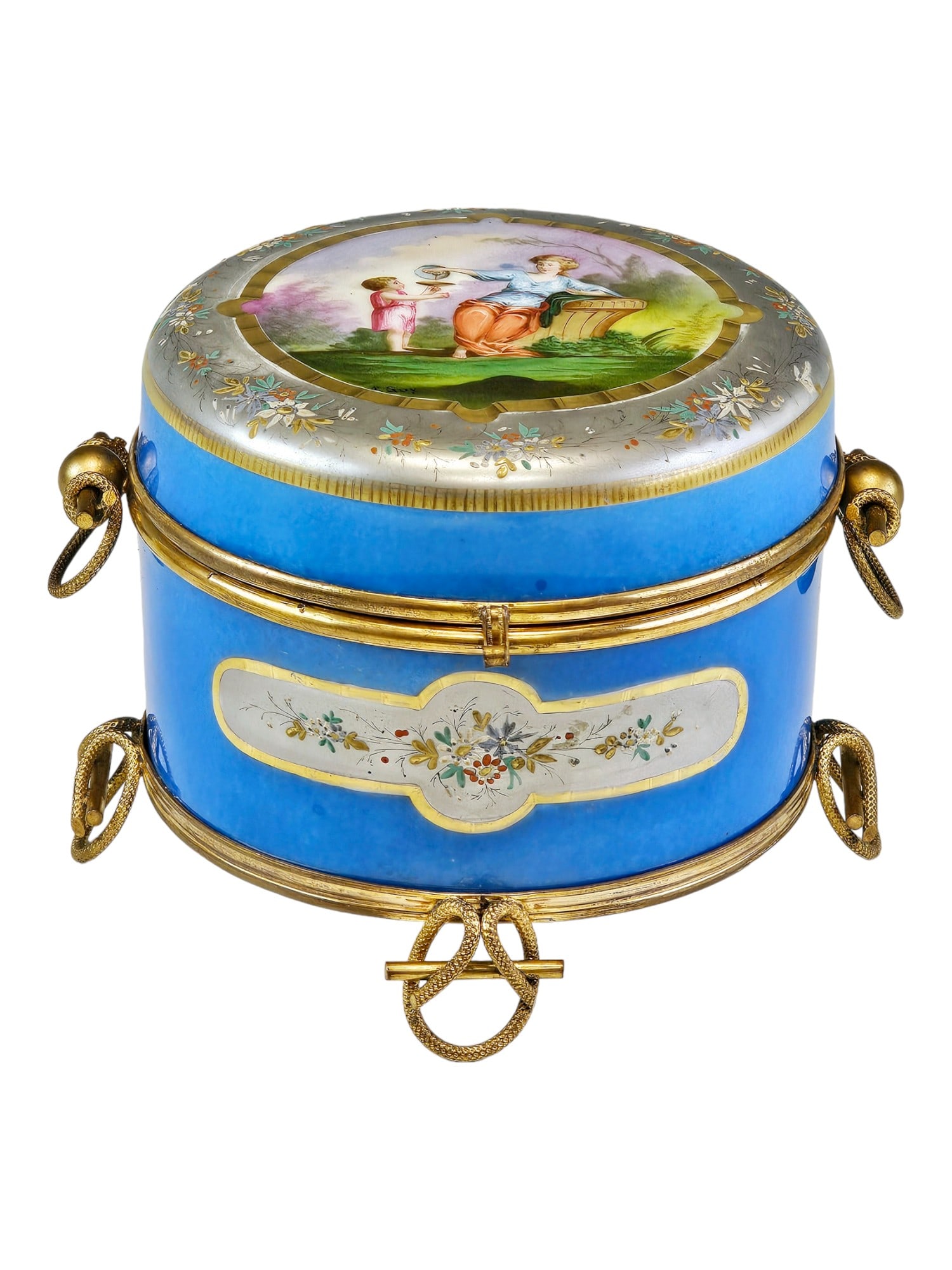ANTIQUE FRENCH SEVRES STYLE PORCELAIN AND BRONZE BOX: An antique French Sevres-style porcelain and gilt-bronze trinket box. Dated late 19th century. The box rests on four ornate legs and features two ring handles on the sides. The lid is adorned with a h