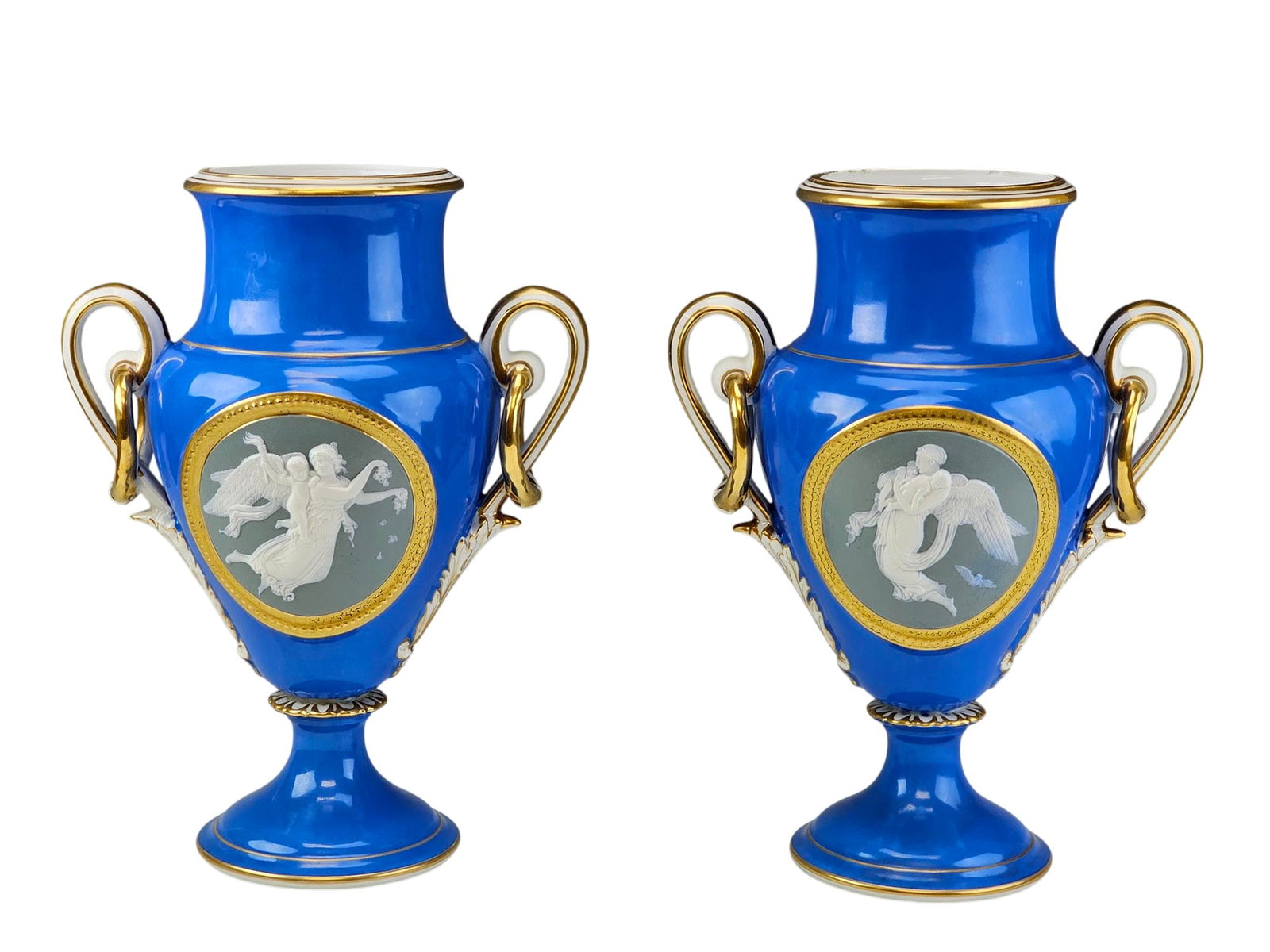 ANTIQUE 19TH C HENRI ARDANT LIMOGES PORCELAIN VASES: A pair of fine French Limoges porcelain vases by Henri Ardant. Dated mid-19th century. The celeste blue color vases are adorned with beautiful ornate gold twin handles. Each vase is decorated with rou
