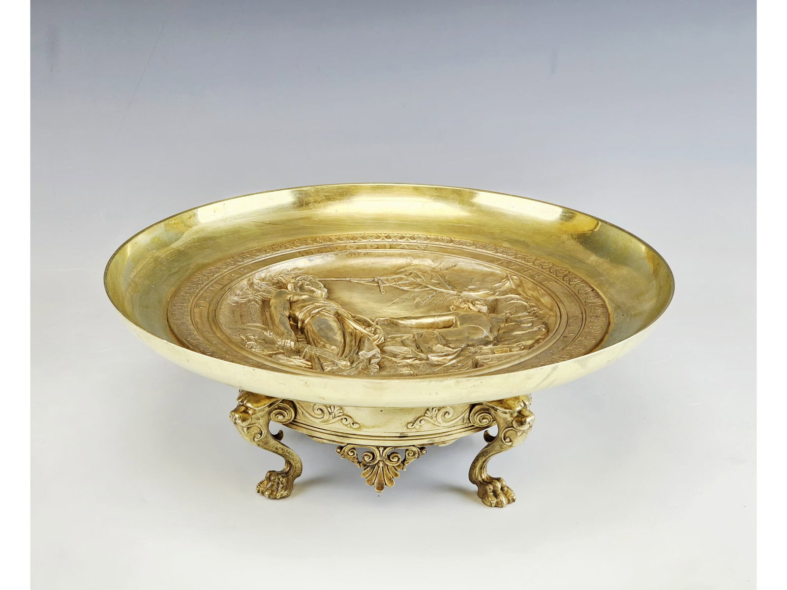 LARGE 19C EMILE PICAULT GILT BRONZE TAZZA CENTERPIECE: An impressive 19th-century French gilt bronze tazza centerpiece designed by renowned sculptor Emile Picault. The shallow wide basin features a finely cast high relief central medallion depicting the b