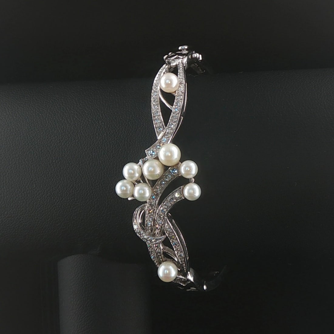 14k White Gold Blue Pearl and 0.75cttw Diamond Vintage Bangle Bracelet 6.75": Condition: Excellent Condition, Professionally Cleaned Metal: 14k Gold (Marked, and Professionally Tested) Weight: 19.7g Gemstones: Assorted Size Pearls Diamonds: 0.75cttw Round Cut Natural Diamonds L