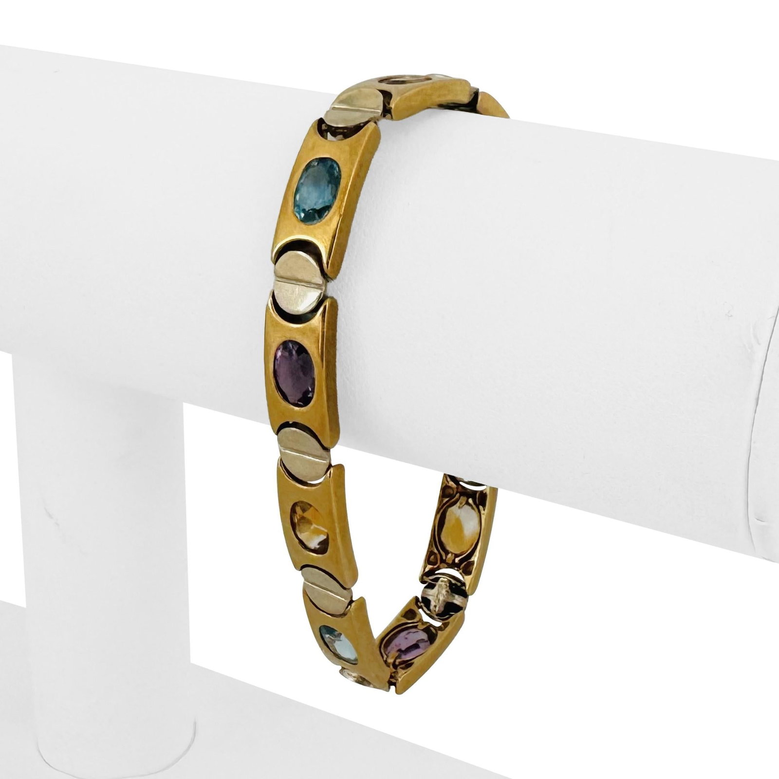 14k Yellow Gold Solid Flush Set Multi Gemstone Screw Motif Bracelet 7.5": Condition: Excellent Condition, Professionally Cleaned Metal: 14k Gold (Marked, and Professionally Tested) Weight: 28.2g Length: 7.5 Inches Gemstones: Flush Set Topaz, Amethyst, and Citrine Width: 8mm