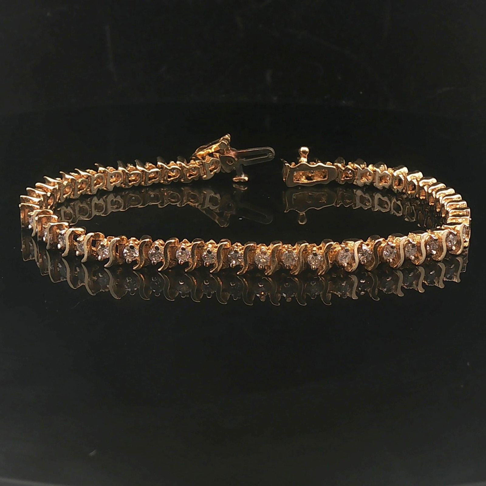 14k Yellow Gold and 2.5cttw Diamond Vintage S Link Tennis Bracelet 7": Condition: Excellent Condition, Professionally Cleaned Metal: 14k Gold (Marked, and Professionally Tested) Weight: 11.3g Diamonds: 2.5cttw Round Cut Natural Diamonds Length: 7 Inches Width: 4.5mm Clos