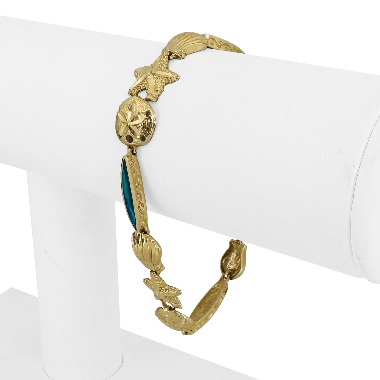 14k Yellow Gold and Opal Beach Ocean Charm Link Bracelet 7": Condition: Excellent Condition, Professionally Cleaned Metal: 14k Gold (Marked, and Professionally Tested) Weight: 11.7g Gemstone: Opal Length: 7 Inches Width: 10mm Closure: Lobster Claw Markings: "14