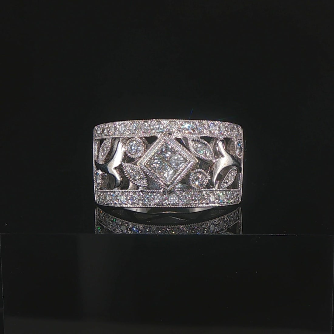 18k White Gold and 0.75cttw Diamond Vintage Floral Filigree Band Ring Size 7: Condition: Excellent Condition, Professionally Cleaned Metal: 18k Gold (Marked, and Professionally Tested) Weight: 10.2g Diamonds: 0.75cttw Round Cut Natural Diamonds Width: 12mm at face, 5mm at back 