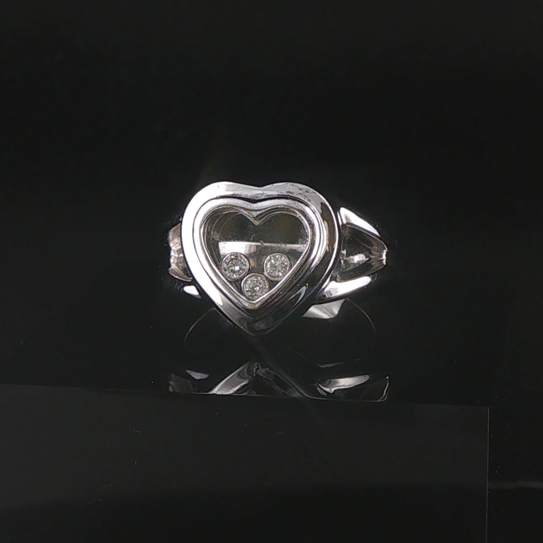 18k White Gold and Floating Diamonds Heart Ring Size 6.5: Condition: Excellent Condition, Professionally Cleaned Metal: 18k Gold (Professionally Tested) Weight: 11.4g Diamonds: Round Cut Natural Diamonds 0.03cttw Face Measurements: 14mm by 14mm Band Width: 3