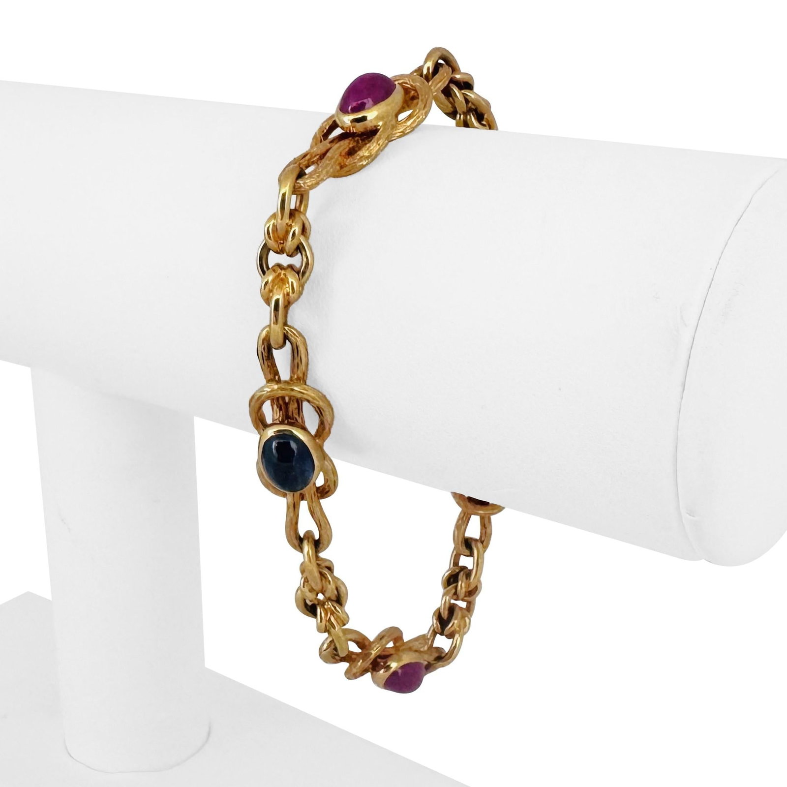 19k Portuguese Yellow Gold Solid Cabochon Sapphire and Ruby Bracelet 7.5": Condition: Excellent Condition, Professionally Cleaned Metal: 19k Gold (Marked, and Professionally Tested) Weight: 28.2g Gemstones: Oval Cabochon Sapphires and Rubies Length: 7.5 Inches Width: 9mm Clo