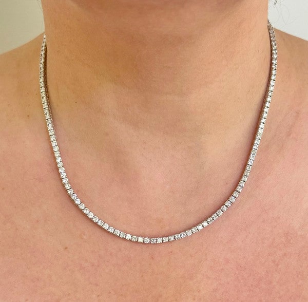 Brand New 12cttw Natural Diamond Tennis Necklace in 14k White Gold 18": Condition: Brand NewMetal: 14k Gold (Stamped)Weight: 16gDiamonds: Round Cut Natural Diamonds 12cttwDiamond Color and Clarity: H and SI3/I1Width: 2.75mmClosure: Box Tab Insert with Two Safety LatchesMa