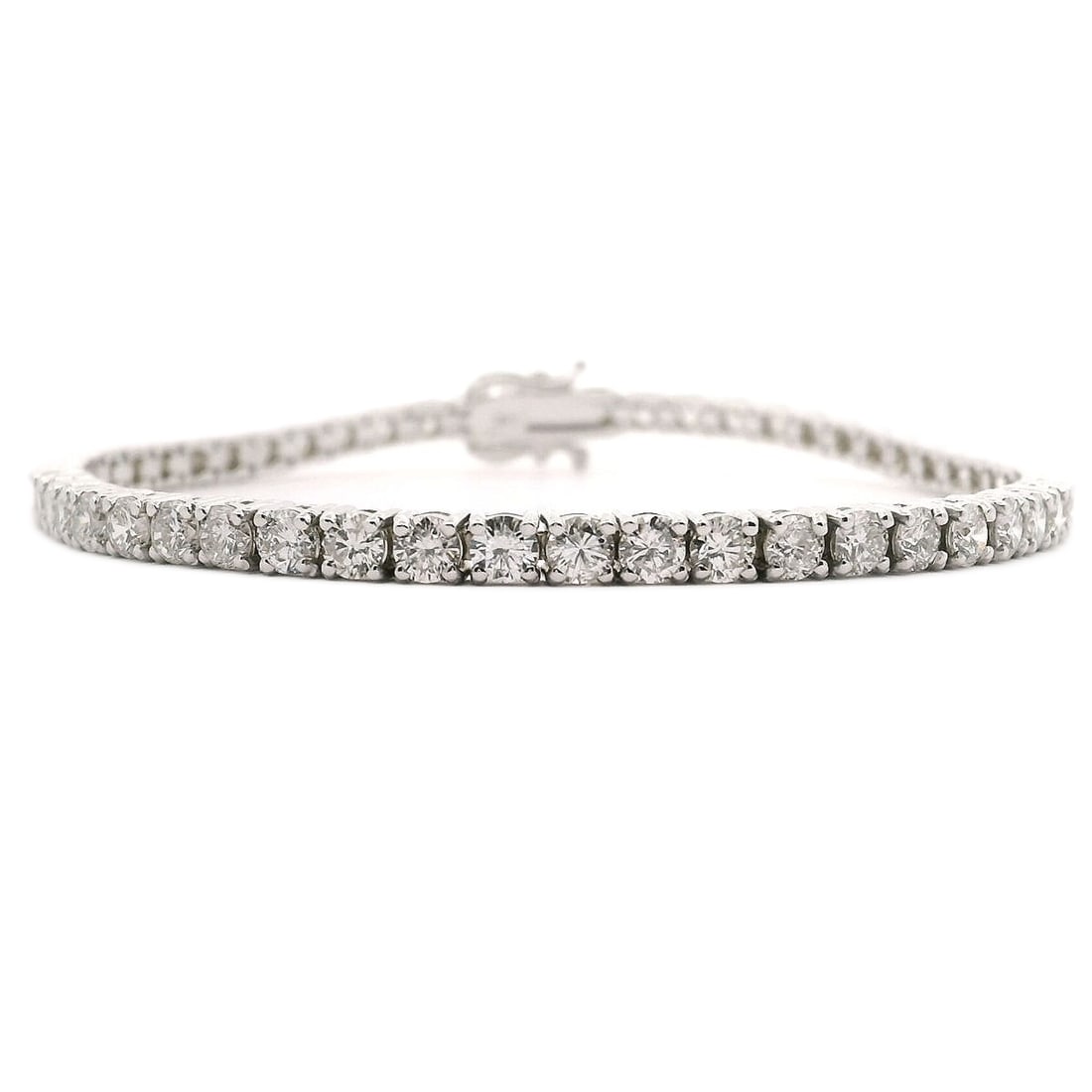 Brand New 6cttw Natural Diamond Tennis Bracelet in White Gold 7": Condition: Brand New Metal: 14k White Gold Weight: 10.9g Length: 7 Inches Width: 3mm Diamonds: Round Brilliant Diamonds 6cttw Diamond Color and Clarity: H and SI3-I1 Closure: Box Tab Insert with Two S