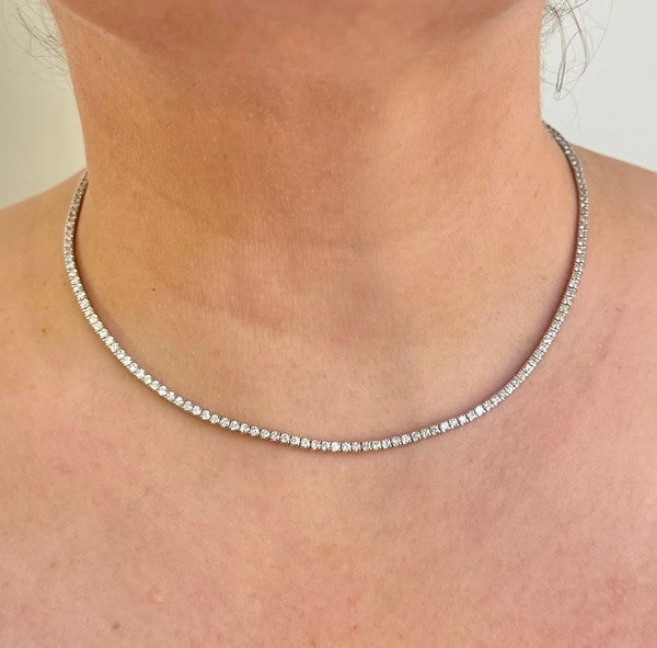 Brand New 6cttw Natural Diamond Tennis Necklace in 14k White Gold 16": Condition: Brand NewMetal: 14k Gold (Stamped)Weight: 14gDiamonds: Round Cut Natural Diamonds 6cttwDiamond Color and Clarity: H and SI3/I1Width: 2.25mmClosure: Box Tab Insert with Two Safety LatchesMar