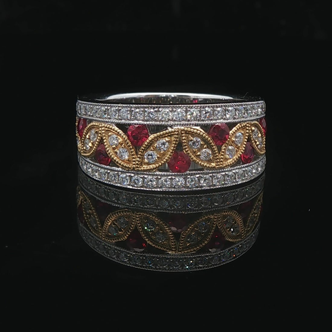 Harry K 18k Yellow and White Gold Ruby Diamond Openwork Band Ring Size 6.5: Condition: Excellent Condition, Professionally Cleaned Metal: 14k Gold (Marked, and Professionally Tested) Weight: 10g Gemstone: 0.50cttw Round Cut Rubies Diamonds: 0.46cttw Round Cut Natural Diamonds