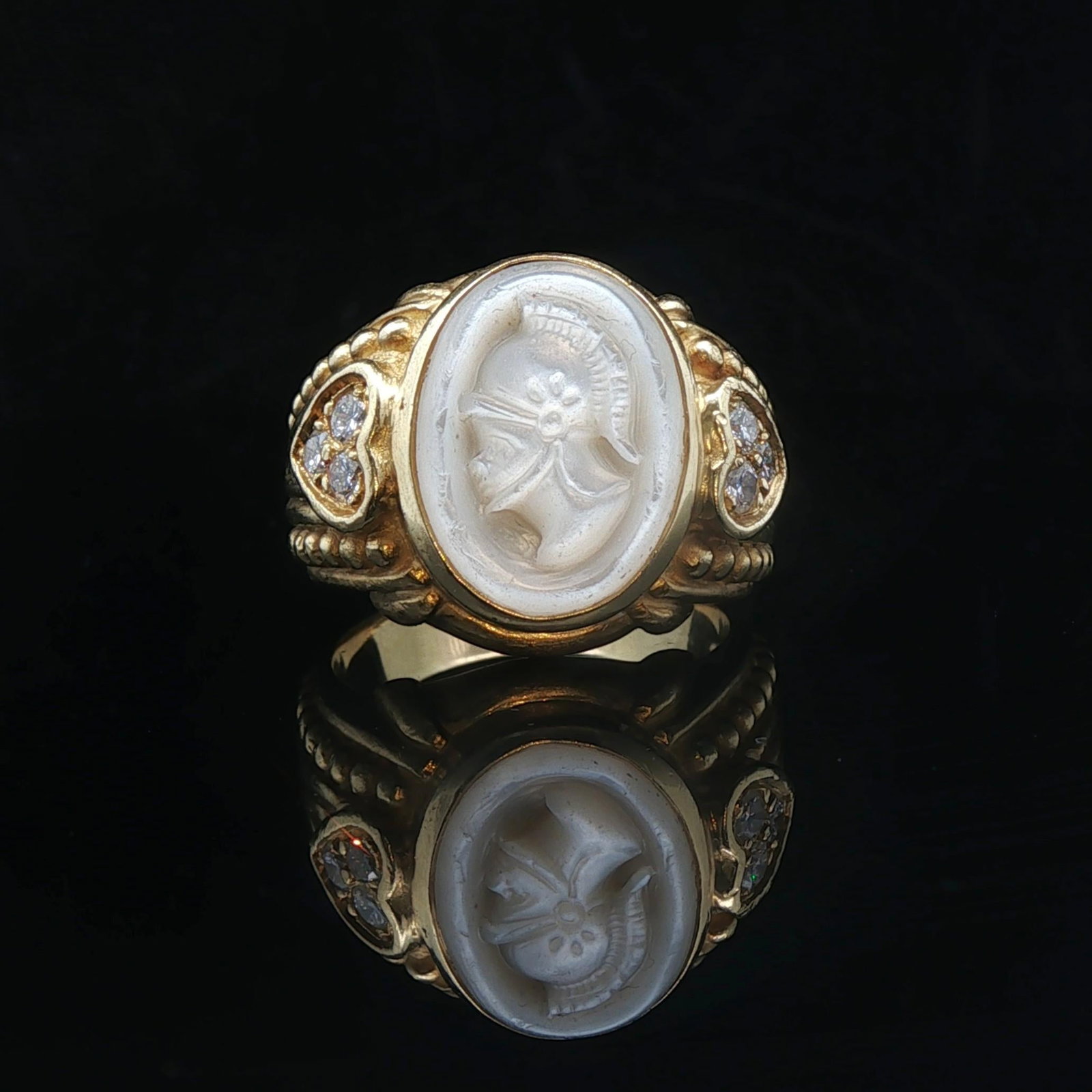 Judith Ripka 18k Yellow Gold Mother of Pearl and Diamond Intaglio Ring Size 9: Condition: Excellent Condition, Professionally Cleaned Metal: 18k Gold (Marked, and Professionally Tested) Weight: 14.7g Gemstone: Carved Mother of Pearl Diamonds: Six Round Cut Natural Diamonds 0.30c