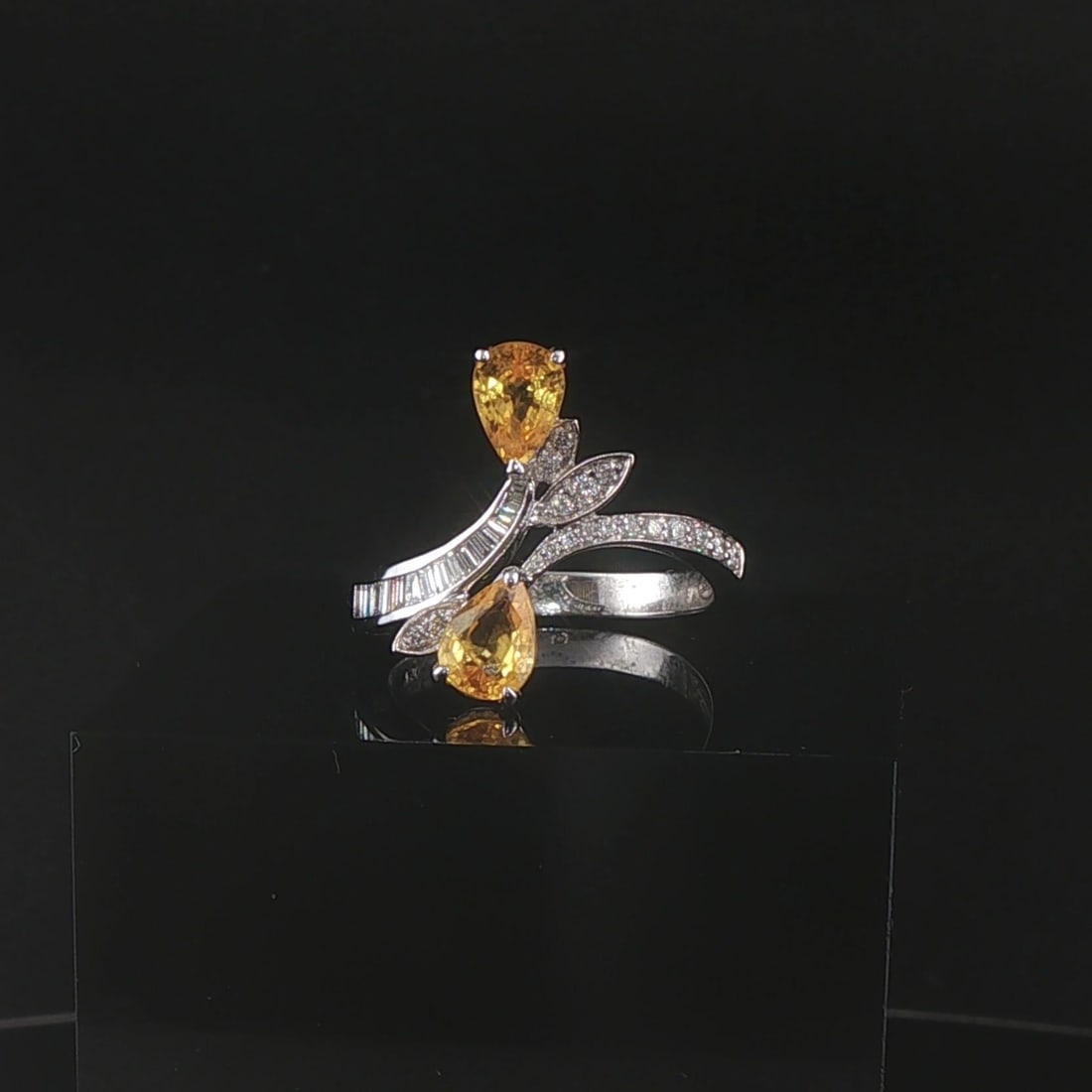 Salavetti 18k White Gold Yellow Sapphire and Diamond Bypass Ring Size 7.25: Condition: Excellent Condition, Professionally Cleaned Metal: 18k Gold (Marked, and Professionally Tested) Weight: 4.8g Gemstone: Two Pear Cut Yellow Sapphires 1.34cttw Diamonds: 0.75cttw Round and Ba
