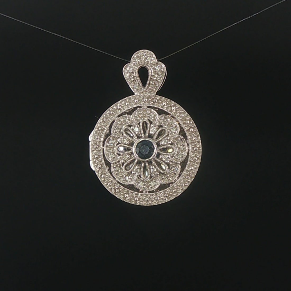 14k White Gold Blue Sapphire and Diamond Vintage Locket Pendant 1.25": Condition: Excellent Condition, Professionally Cleaned Metal: 14k Gold (Marked, and Professionally Tested) Weight: 10g Gemstone: 4mm Round Cut Blue Sapphire Diamonds: 0.20cttw Round Cut Natural Diamon