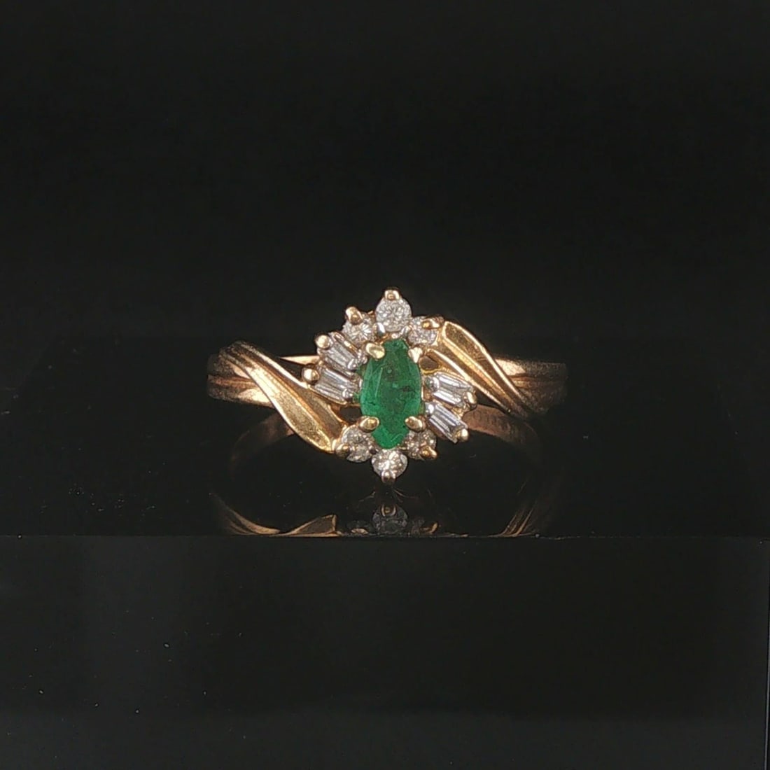 14k Yellow Gold Emerald and Diamond Ladies Vintage Ring Size 6.5: Condition: Excellent Condition, Professionally Cleaned Metal: 14k Gold (Marked, and Professionally Tested) Weight: 2.6g Gemstone: 0.20ct Marquise Cut Emerald Diamonds: 0.40cttw Round and Baguette Cut 