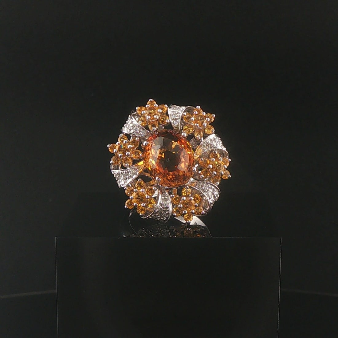 18k White Gold Citrine and Diamond Large Halo Ring Size 7: Condition: Excellent Condition, Professionally Cleaned Metal: 18k Gold (Marked, and Professionally Tested) Weight: 12.4g Gemstones: Oval and Round Cut Citrines Diamonds: 0.35cttw Round Cut Natural Dia