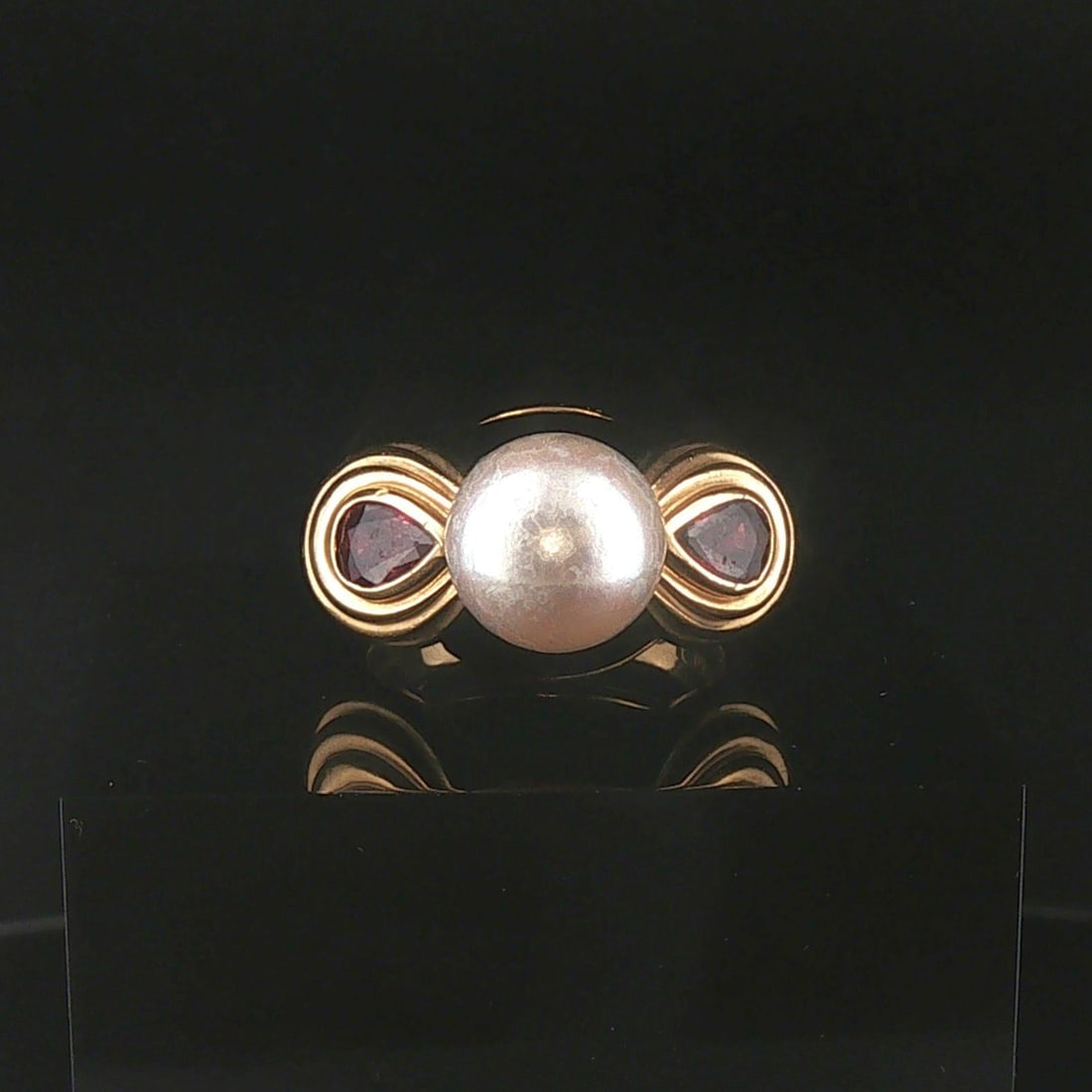 18k Yellow Gold Pearl Red Garnet and Enamel Vintage Ring Size 6.25: Condition: Excellent Condition, Professionally Cleaned Metal: 18k Gold (Marked, and Professionally Tested) Weight: 11.5g Gemstone: Two Pear Cut Red Garnets Diamonds: 10mm Pearl Face Measurements: 21.5