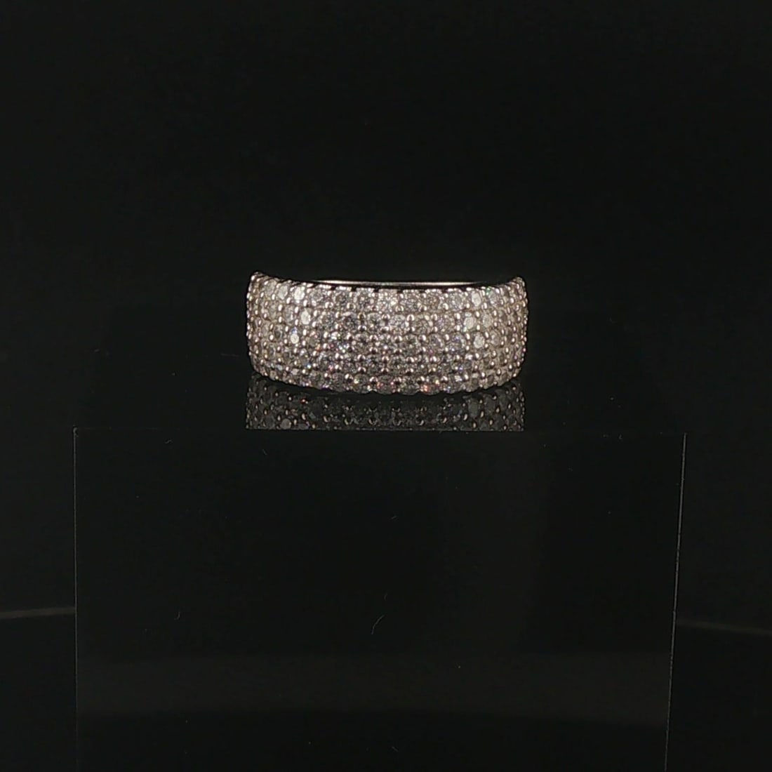 14k White Gold and Pave Set Cubic Zirconia Ladies: Condition: Excellent Condition, Professionally Cleaned Metal: 14k Gold (Marked, and Professionally Tested) Weight: 3.5g Gemstones: Round Cut Cubic Zirconias Width: 7.5mm at widest, 3mm at narrowest