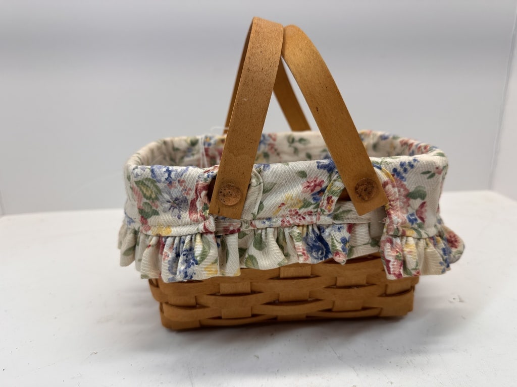 LONGABERGER BASKET: LONGABERGER BASKET WITH TWO HANDLES, WHITE FLORAL CLOTH INTERIOR