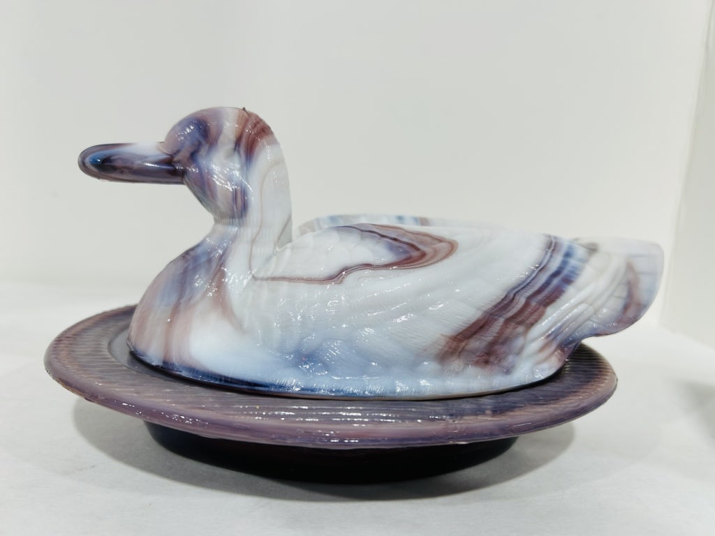 WESTMORLAND SLAG DUCK IN A BASKET: .
