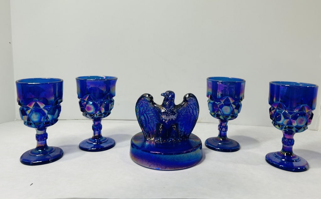 5-Piece Set of Fenton Art Glass American Bicentennial Cobalt Carnival Glass Goblets and Eagle: This set of five pieces was produced by the Fenton Art Glass Company in 1976 to commemorate the United States Bicentennial. The collection is comprised of four goblets and one eagle figurine crafted f