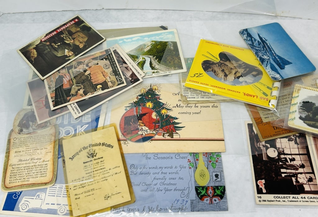 Vintage Ephemera and Collectible Trading Cards: An assortment of mid-20th-century paper goods and ephemera including trading cards, postcards, holiday greetings, and informational documents. The collection features several 1966 The Monkees trading 