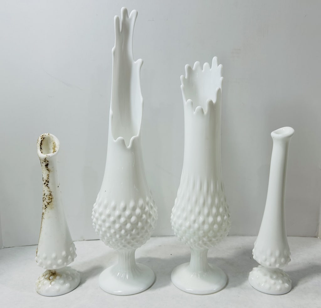 White Milk Glass Hobnail Vases Attributed to Fenton: A collection of white milk glass vases featuring the hobnail pattern, attributed to the Fenton Art Glass Company. The group includes several pieces of varying heights and rim treatments. Among the sel