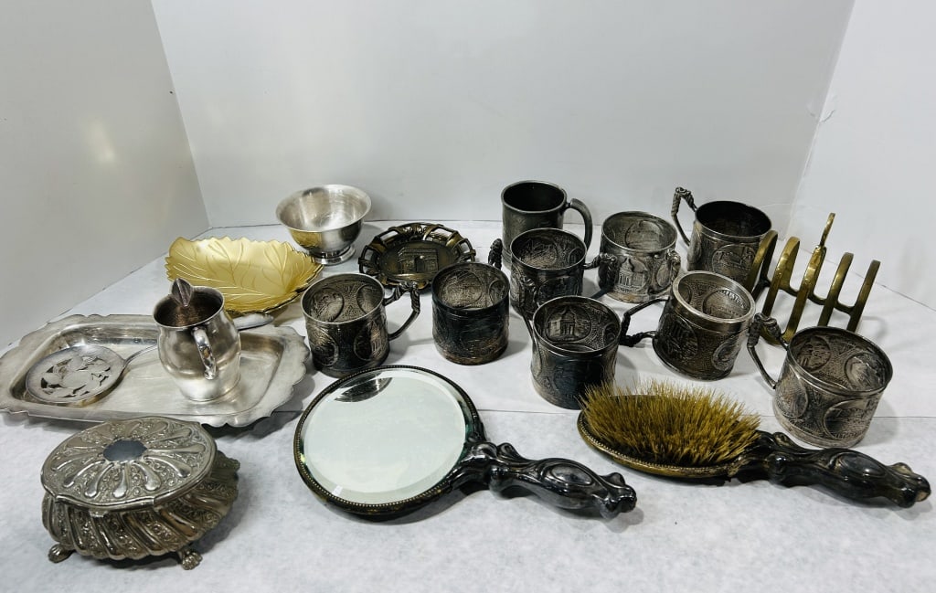 Vanity Items Including a Fisher Sterling Silver Bowl: This group consists of a variety of metal household and vanity objects. A primary item is a small sterling silver bowl with a flared rim and circular foot, marked on the base with the Fisher maker sta